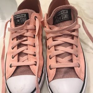 Converse pink sparkly shoes.